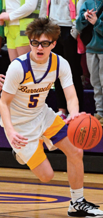 Brigham Schauff drives down the court. Photo by Anita Schmid. Carvajel 1.