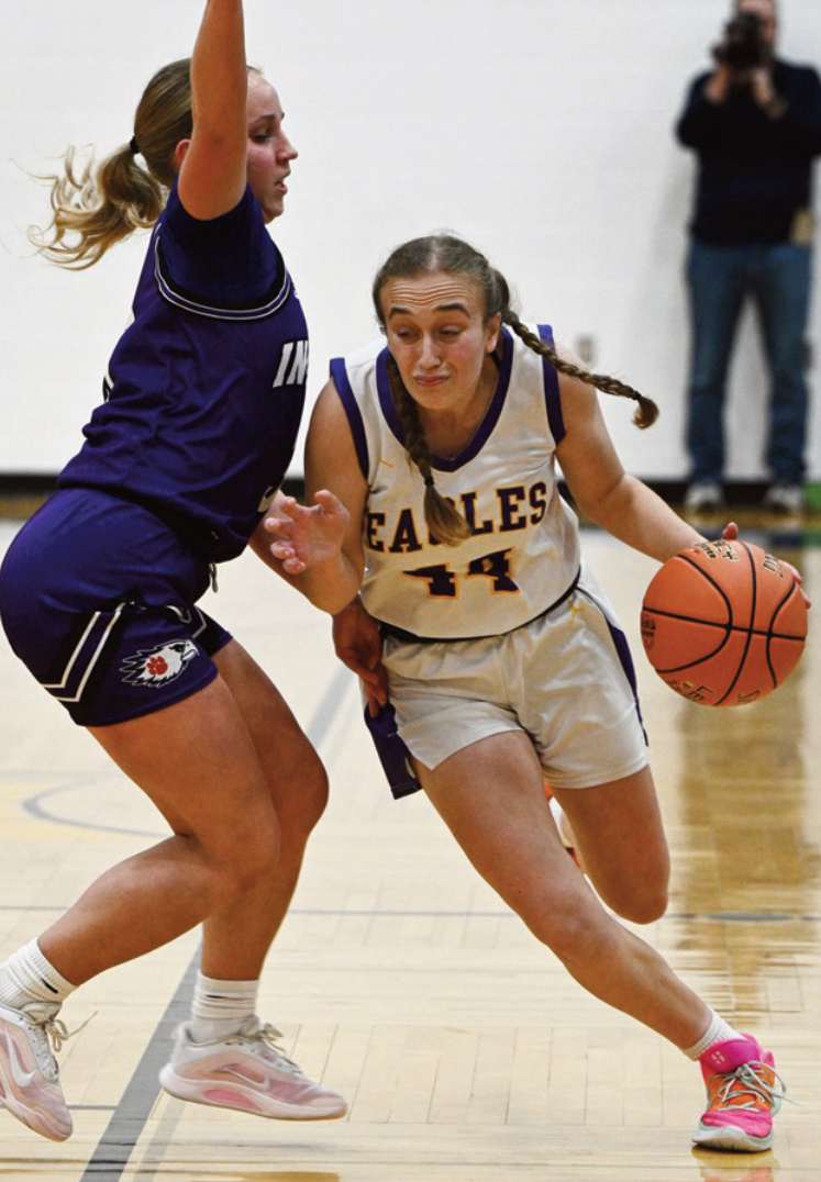Izzy Durst works her way around an Indee defender on her way to the basket. Photo by Anita Schmid.