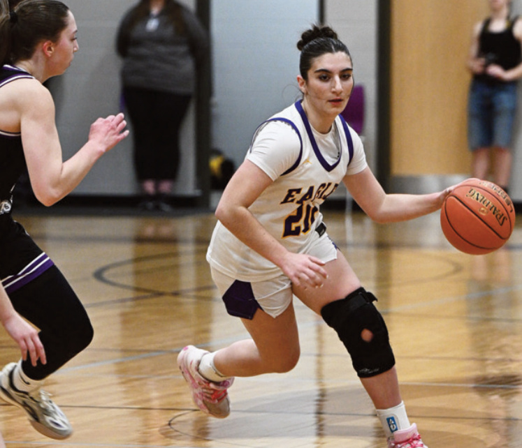 Hannah Esch drives around a River Ridge defender. Anita Schmid photo.