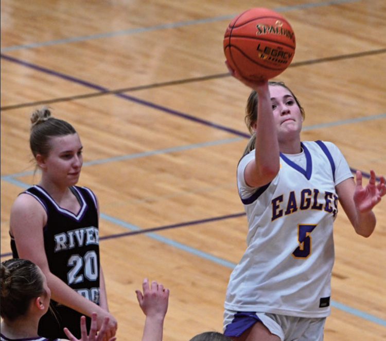 Eagle Erin Lasse gets through the River Ridge defense. Anita Schmid photo.