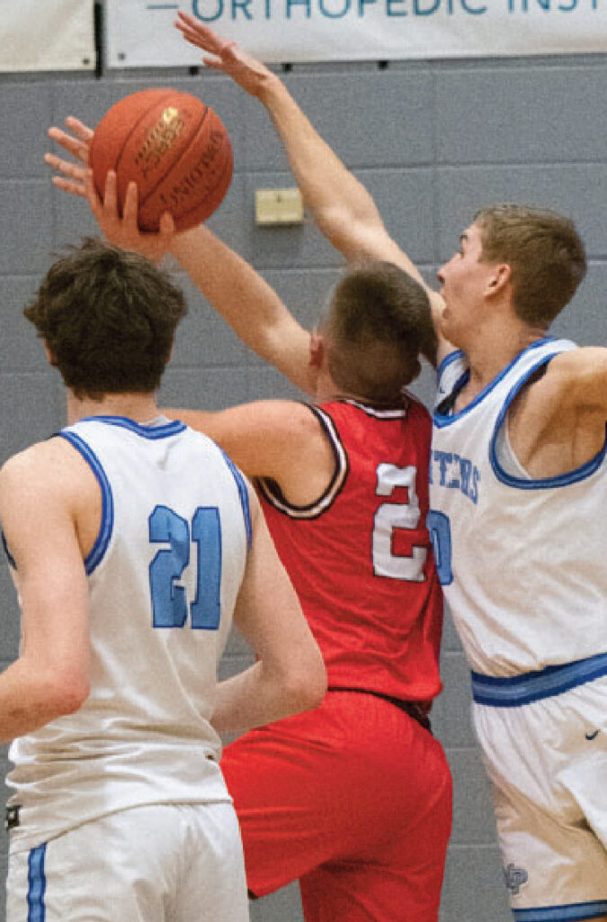 Pointer Cole Ripp tries to block a shot on a Bulldog with Keaton Dempsey (21) looking on. Photo by Robin Wiegman.