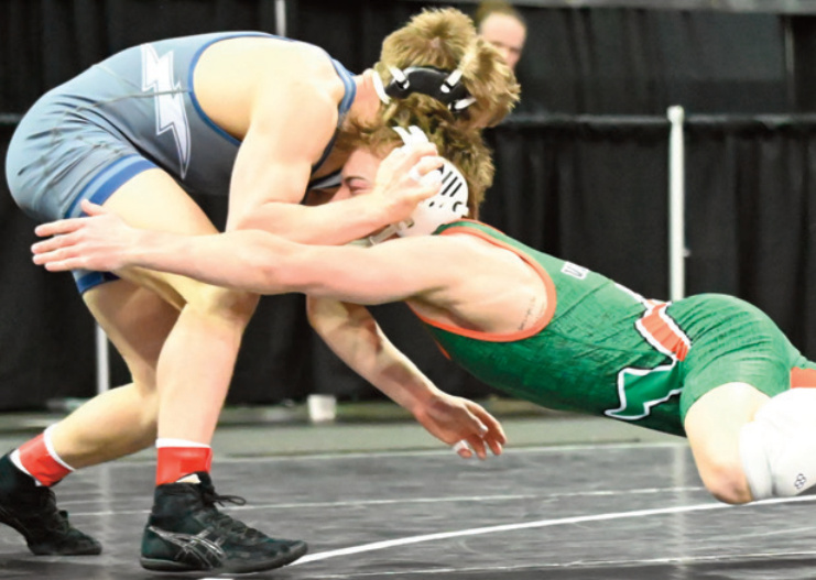 Pecatonica/Argyle's Lukas Orloff dives in for a takedown. Heather Olson photo.