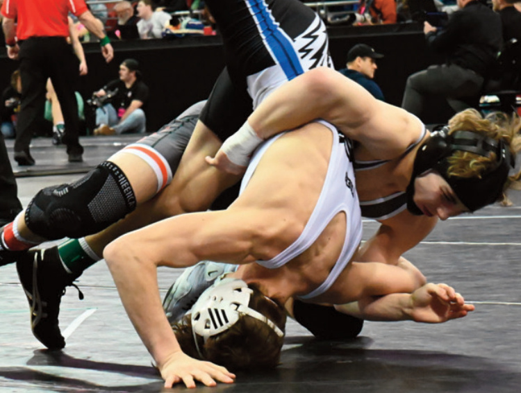 Dodger Shane Rochon has his opponent in trouble. Heather Olson photo.