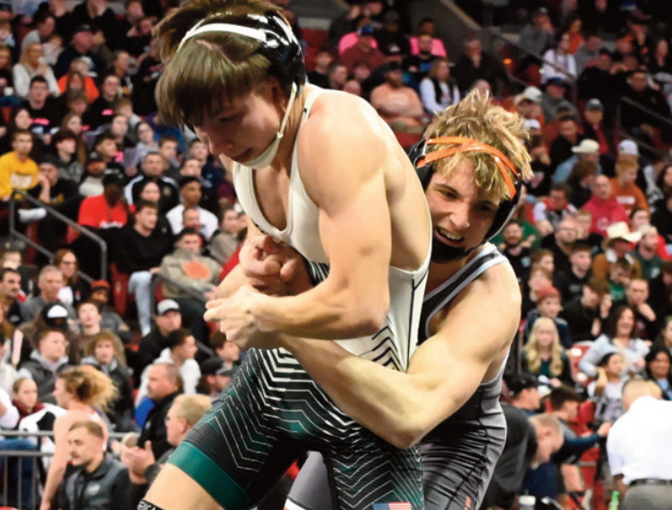 Dodger Nathan Johnson looks to take down his opponent. Heather Olson photo.