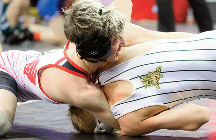 IG/H's Griffin Wineski tries to turn his opponent. Jonelle Degenhardt photo.