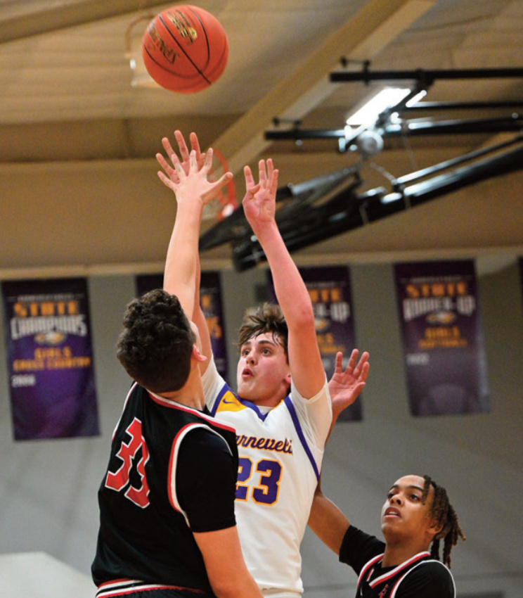 Judson Poad puts a shot up just over the outstretched hand of a defender. Photo by Anita Schmid.