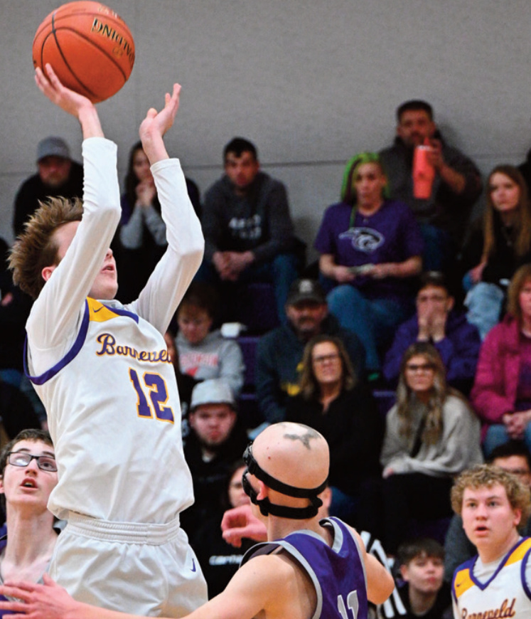 Barneveld senior Noah Doescher goes high for a shot. Anita Schmid photo. J-Hess 2 Doescher 1, Larson 2, Schauff 1. B-Leuzinger 2, Thousand 1, Schlimgen 1, Poad 2