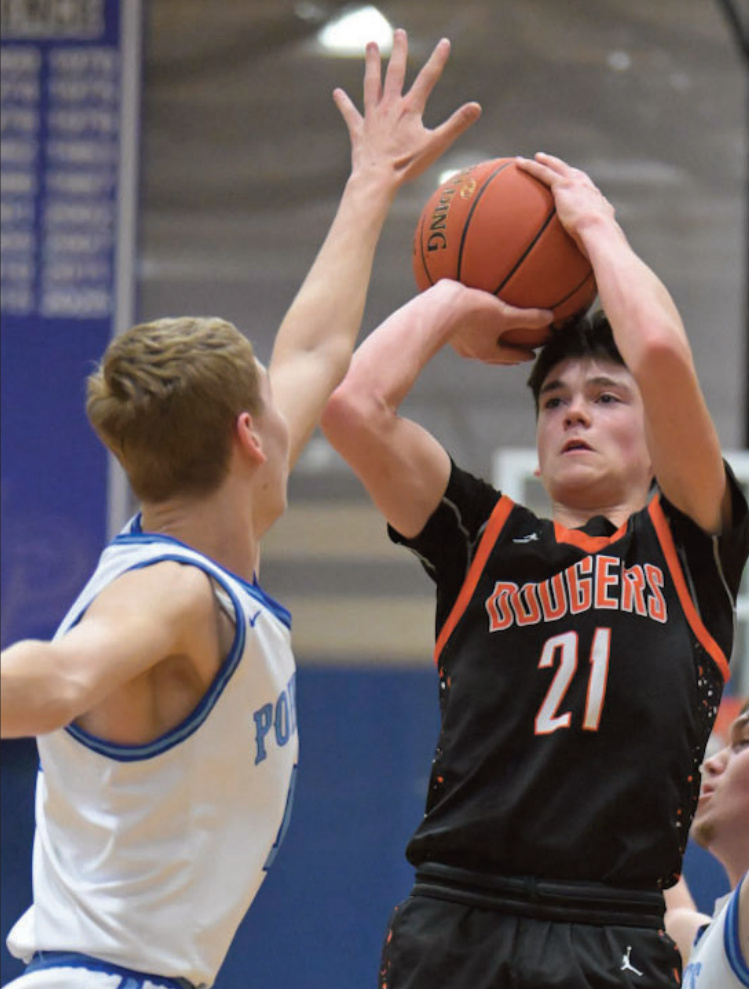 Dodger Jayce Halverson goes up for a ahot defended by Pointer Cole Ripp. Photo by Bret Peterson.