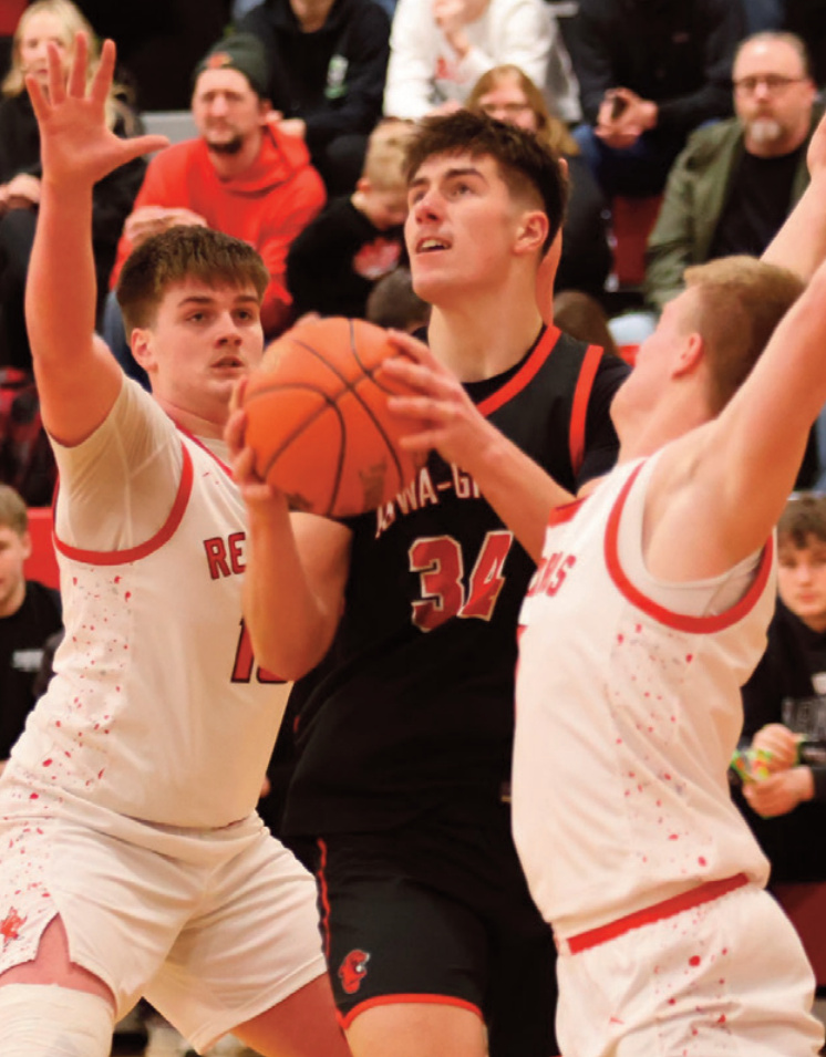 Panther Treaton Loeffelholz tries to split a pair of Darlington defenders. Photo by David Friesen.