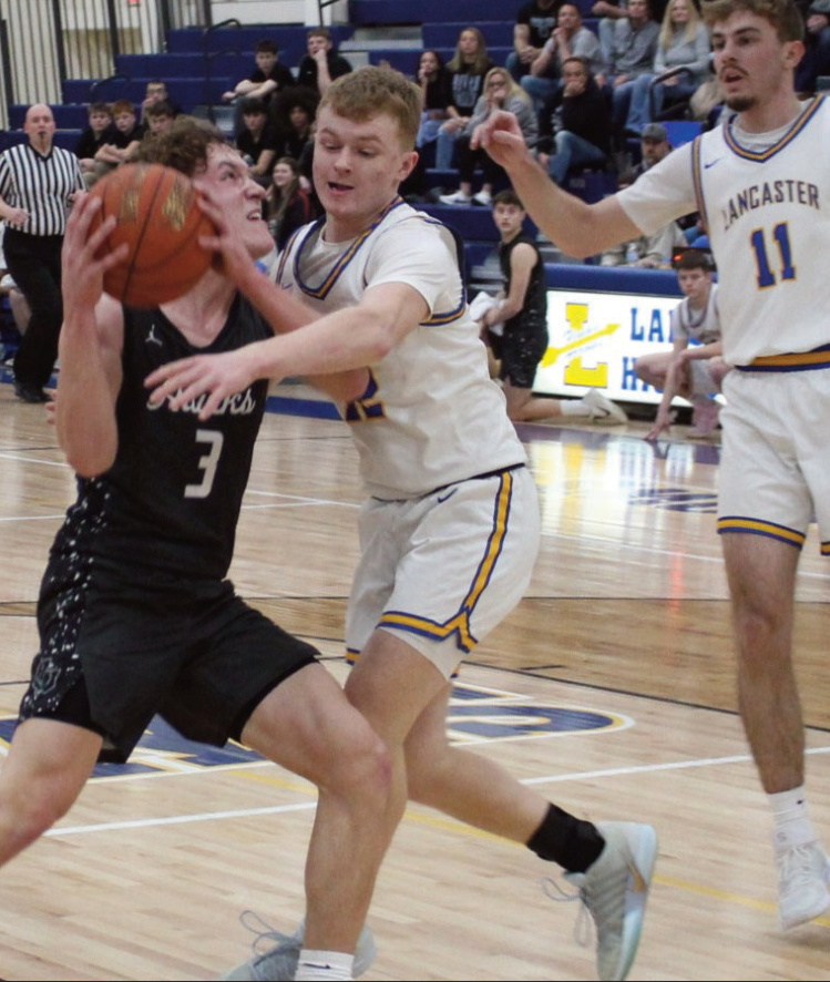 Blackhawk Senior Lucas Klein drives it hard to the hoop against Lancaster Thursday night. John Dalton photo.