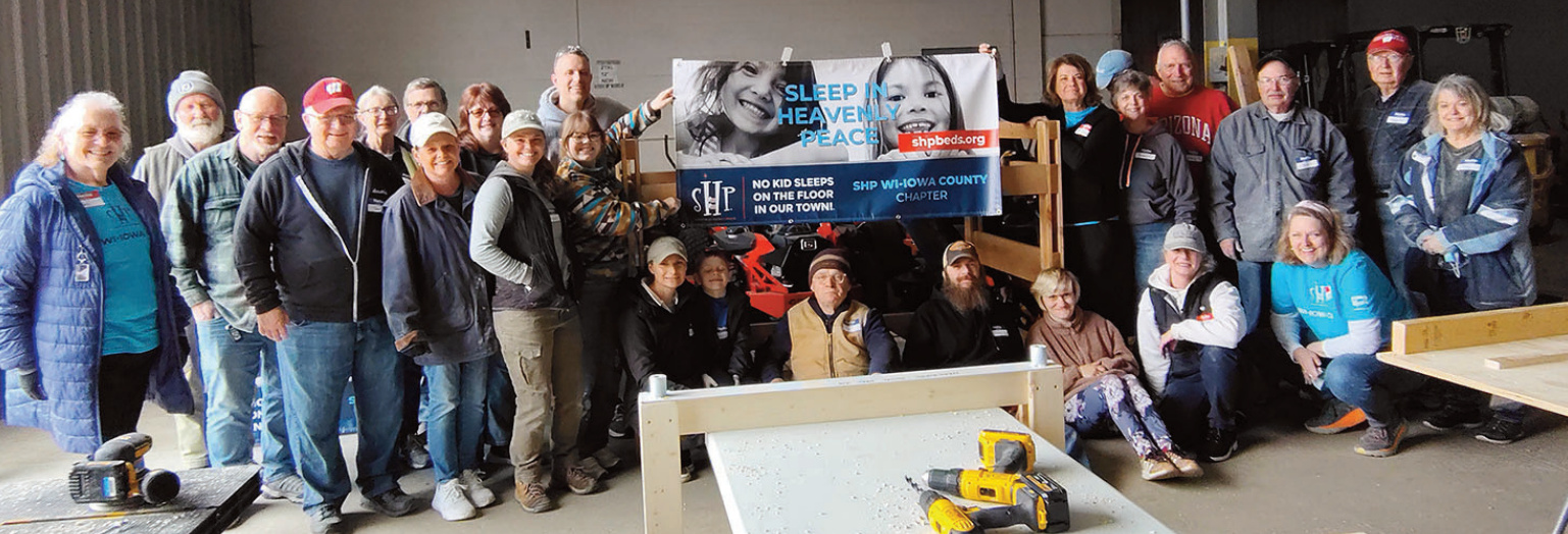 Group photo of those who participated in building of the beds