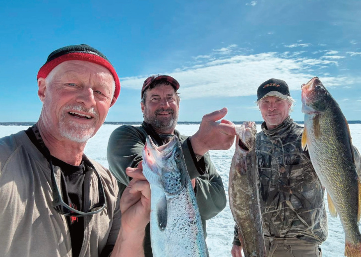 left to right, Life long pals Jeff Moll, Doug Cibulka and Mark Walters at the conclusion of a 4 day ice camping trip on Lake Superiorat Ashland.