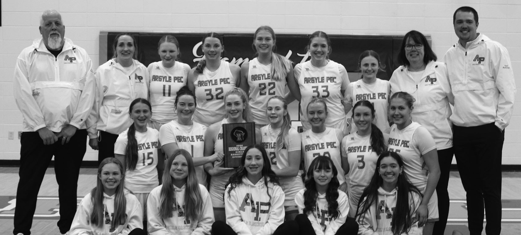 Front row left to right: Hadley Syse, Tilly Weber, Jade Wellnitz, Piper Erickson, Ivy Flannery, 2nd Row left to right: Emma Johnsen, Kylie Butler, Brooke Wellnitz, Avari Steiner, Brooklynn Johnsrud, Loretta Tisch, Aleah Harris. 3rd Row left to right: Coach Bruce Jackson, Coach Jen Krogman, Macy Harris, Lexi Wonders, Jozie Neff, Calla Stateler, Leaha Doescher, Coach Linda Hendrickson, Coach Anthony Hendrickson.