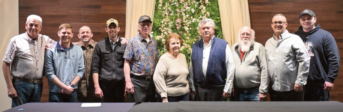 Shown with 2026 Hall of Fame inductee Tim Wunnikee (left0 are previous inductees (l-r) Bobbie Wunnicke, Grant Sutter, TJ Wunnicke, Jerry (Cowboy) Olson, Bev Reukauf, Al Jewell, Randy Meudt, Eric Reukauf and Brady Wetter.