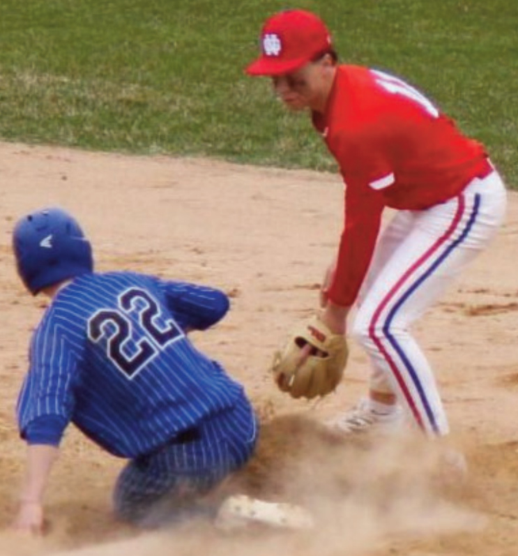 Pointer Adam Cody slides under the tag at second base in a game against New Glarus Thursday. Photo by John Dalton.