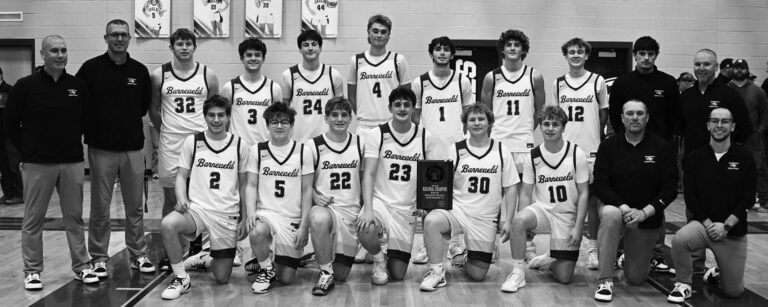 Barneveld boys basketball claimed the Division 5 Regional Championship. Team members are (l-r) kneeling: Kaydn Schlimgen, Brigham Schauff, Liam Genrich, Judson Poad, Karsen Leuzinger and Landon Beicher and Coaches Jason Poad and Ben Anderson; standing: Coaches Jeremy Esch and Nate Wood, Henry DeRosier, Konnor Jasinksi, Ty Thousand, Mason Durst, Cooper Shipman, Hunter Larson and Noah Doescher and Coaches Gavin Fishnick and Head Coach Tyler Sullivan. Photo by Anita Schmid.