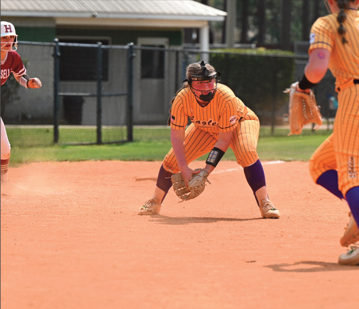 Mya Norton snags the ball and looks to toss to first. All photos by Anita Schmid.