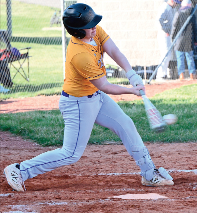 Karson Leuzinger steps into a pitch and connects. Photo by Anita Schmid.