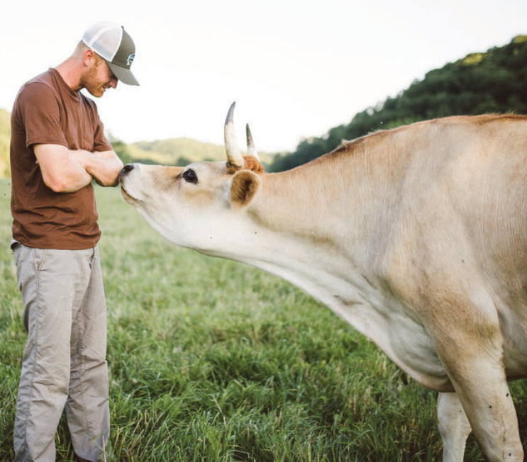 Eric Cates is shown with one of his cows. your new plants.