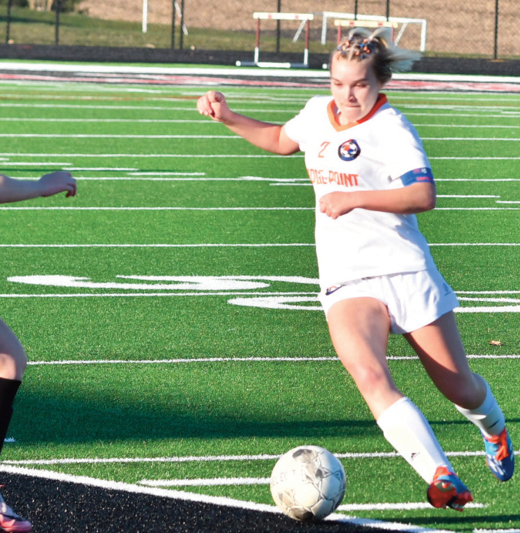 Ella Wilson looks to move the ball.