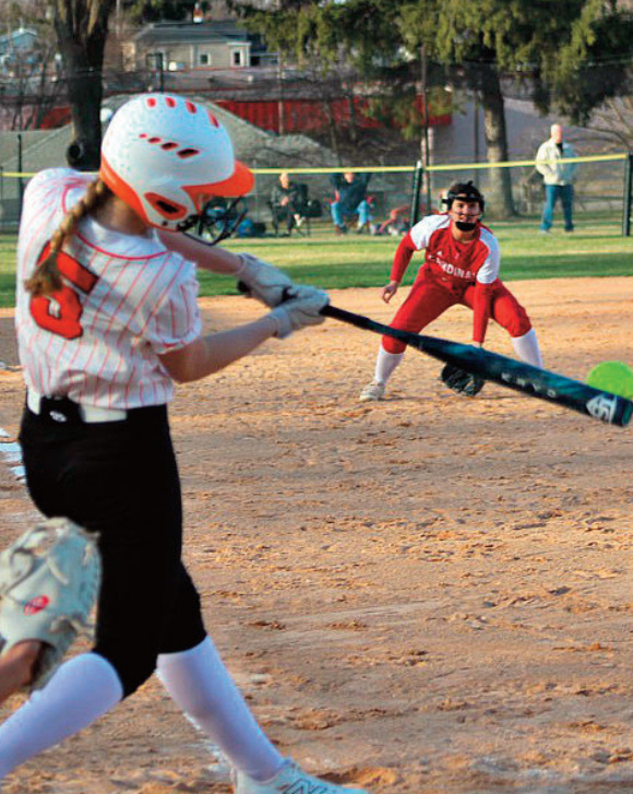 Emma Dougherty connects with the ball. Photo by Angie Borne.