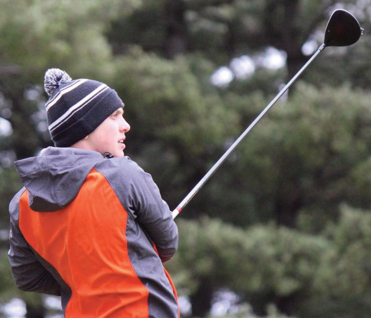 Dodger freshman Connor Hottmann watches his tee shot Saturday at the Dodge Point Invitational. John Dalton photo.