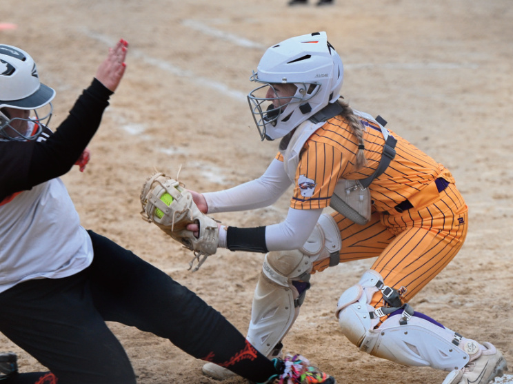 Eagles catcher Reagan Knight tags an Argyle/Black Hawk runner out at home. Photo by Anita Schmid.