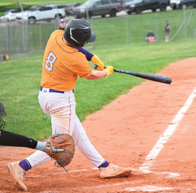 Aden Knight connects with a pitch. Photo by Anita Schmid.
