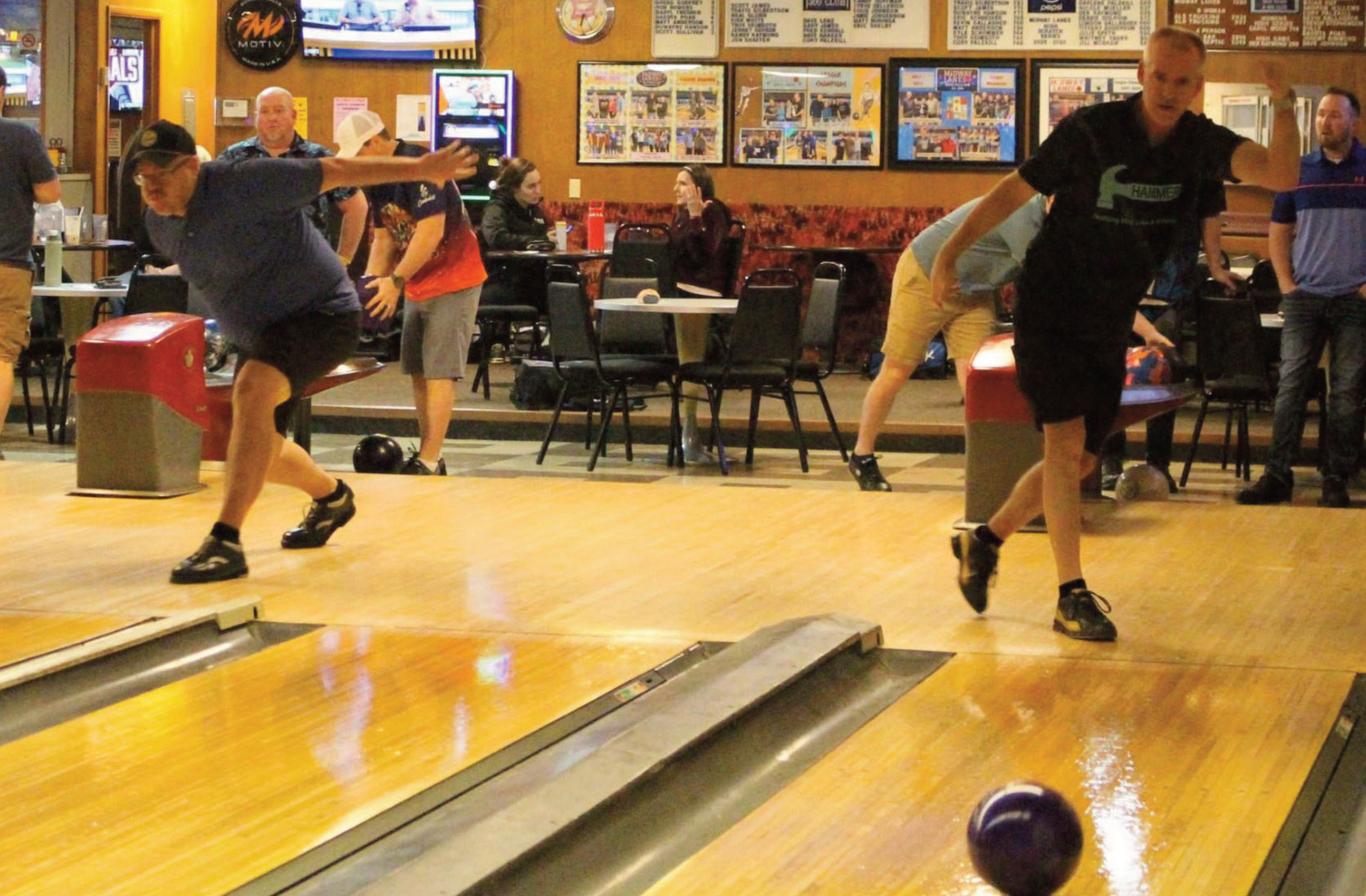 Craig Mueller (right) and Wade Harker bowling in a qualifying round Saturday at Midway Lanes Scratch Invitational
