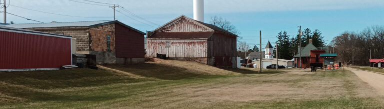 The side track area now. The first building was the Livestock Yard. The big building was for feed and fertilizer sales. The far, one-story building was Ridgeway Lumber and Fuel.