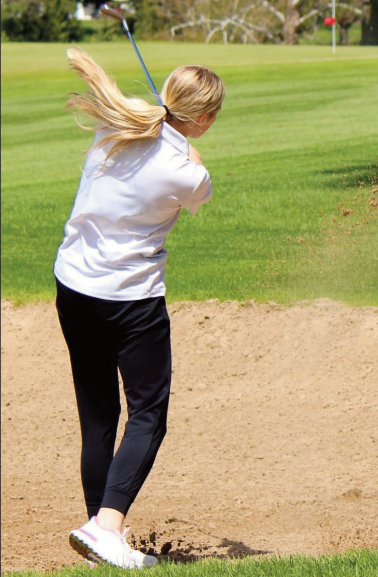Blasting out of a fairway bunker is Argyle/Pecatonica's Avari Steiner at the Plat- teville Invitational Saturday. John Daltion photo.