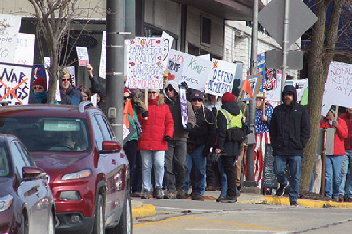 About 500 people marched down lowa Street in Dodgeville Sunday from the lowa County Courthouse area to the "Green Space" on West Fountain Street in a "No King" rally. NO KINGS is a nonviolent national day of action and mass mobilization in response to the increasing authoritarian excesses and corruption of the Trump administration. Indivisibles of Southwest Wisconsin Leadership Team member said in a press release: "NO KINGS is a nonviolent national day of action and mass mobilization in response to the increasing authoritarian excesses and corruption of the Trump administration." There was music, speakers and the singing of the National Anthem.
