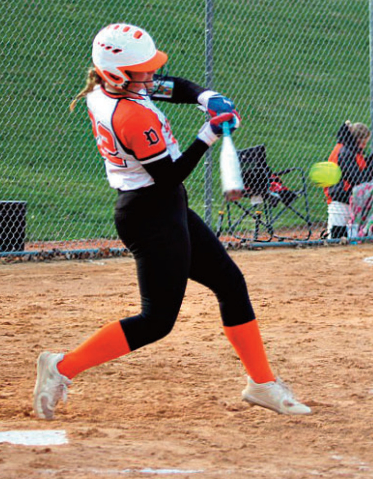 Addison Reilly drives one up the middle. Photo by Angie Borne.