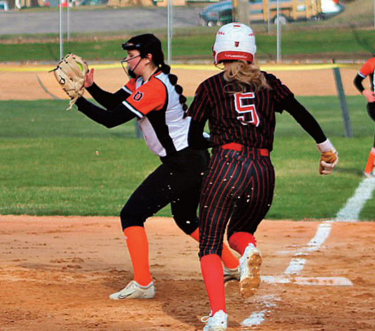 Dodger Alana Bradley snags a throw at first to retire an Iowa-Grant hitter Myah Batton at first base. Photo by Angie Borne.