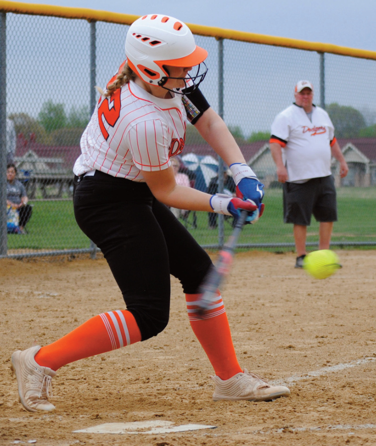 Addie Reilly goes down to get the ball for a hit. Photo by Tommi Crubaugh