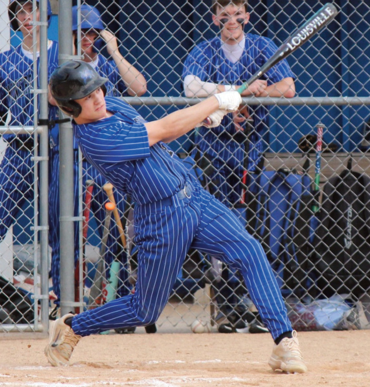 Pointer Elliot Kite connects on one of his two hits against Platteville in Thurs- day afternoon action. Photo by John Dalton.