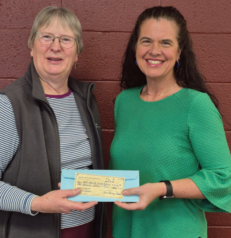 Above, Julia Harman, lowa County-ADRC Nutrition Coordinator, receiving a check from Donna Peterson (left) - United Fund of lowa Co.
