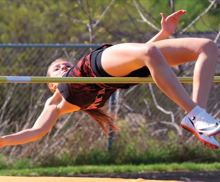 lowa-Grant's Ruby Volenec clears the high jump bar. Photo by David Friesen.