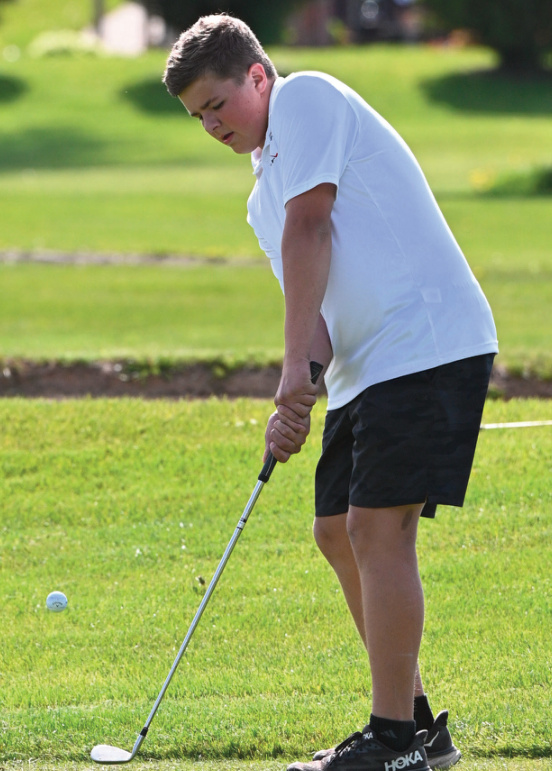 iowa-Grant's Owen Munson chips a shot.