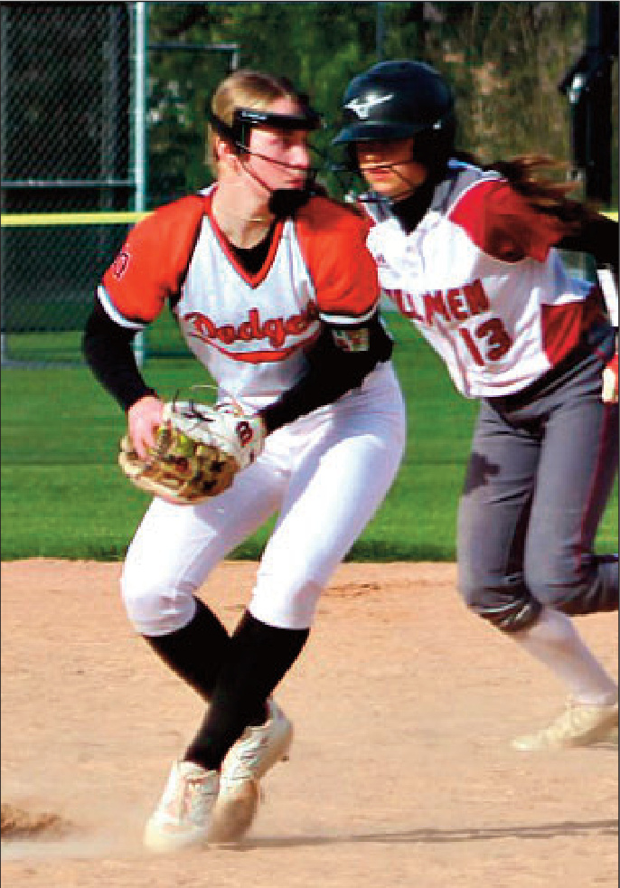 Dodger shortstop Emma Dougherty fields a grounder and throws to first. Photo by Angie Borne.