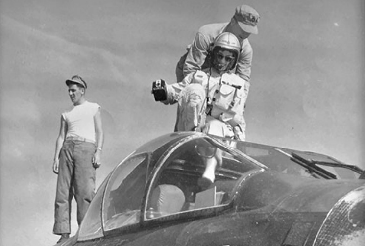 Lee Lepinske being helped out of a fighter jet