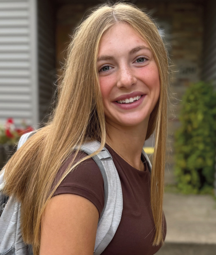 Kendra Brom standing with backpack