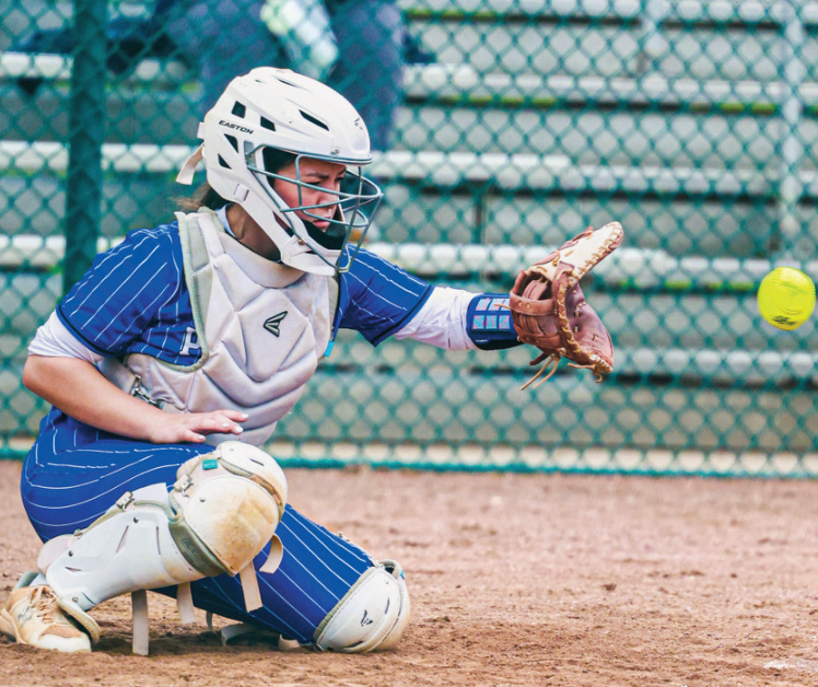 Pointer Jaycee Tibbits gathers a pitch from her catcher's position. Photo by Izzy Dannenberg.