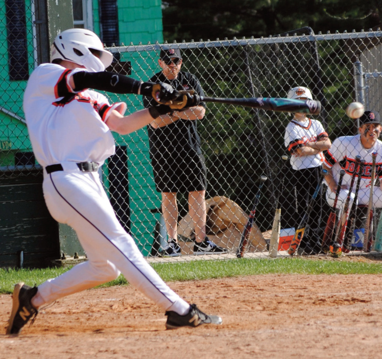 Jack Graber connects on a pitch. Photo by Tommi Crubaugh.