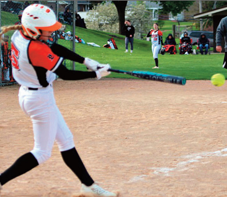 Emma Dougherty sends out a hit. Photo by Angie Borne.