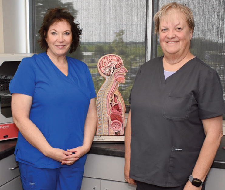 Lisa Edge stands with Kris Schoville