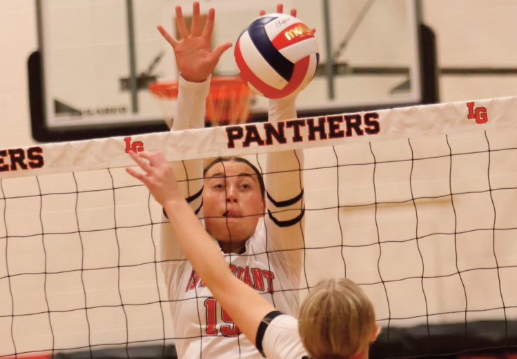 I-G freshman Charley Draude goes up for a block. David Friesen photo.