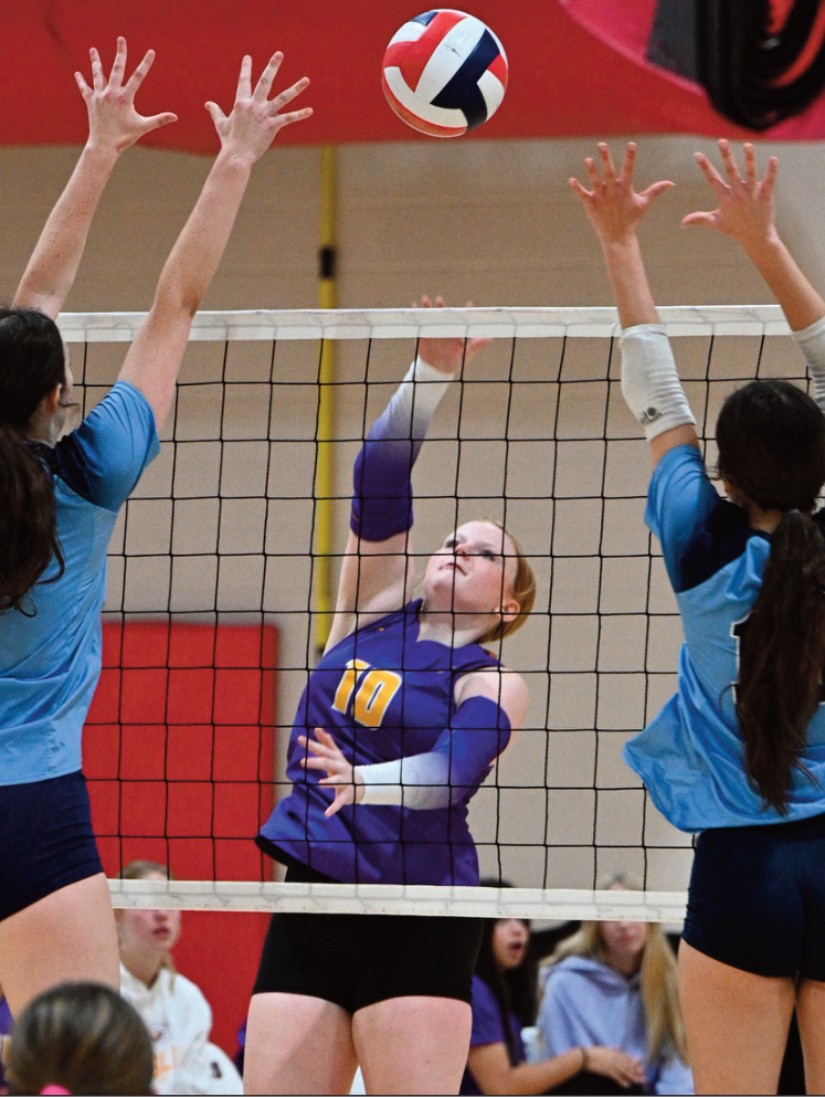 Eagle Kylie Helsig puts a shot between two defenders. Anita Schmid photo.