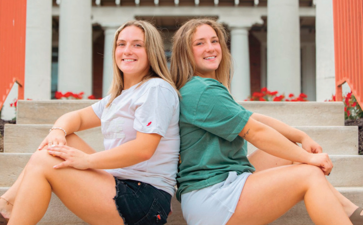 Twin sisters Pajessa and Trinity Baker of Cobb get settled into the Grace Col- lege campus.