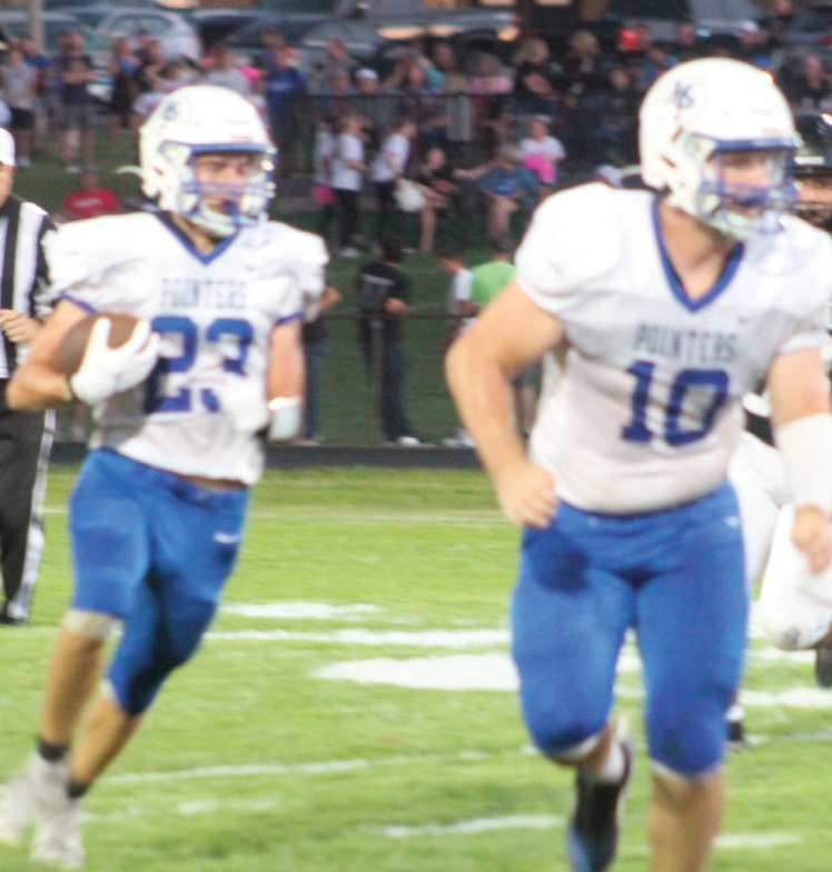 Pointer Cowan Bishell follows the blocking of Clayton Yanna. Eric James photo.
